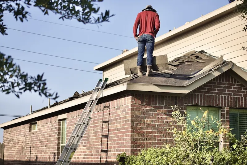 Professional roofer working on a residential roof in Turtle Lakes